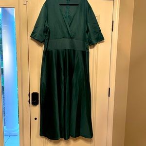 Flattering green midi dress with flared skirt